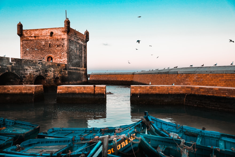 Blue fishing boats and the ramparts of Essaouira's port